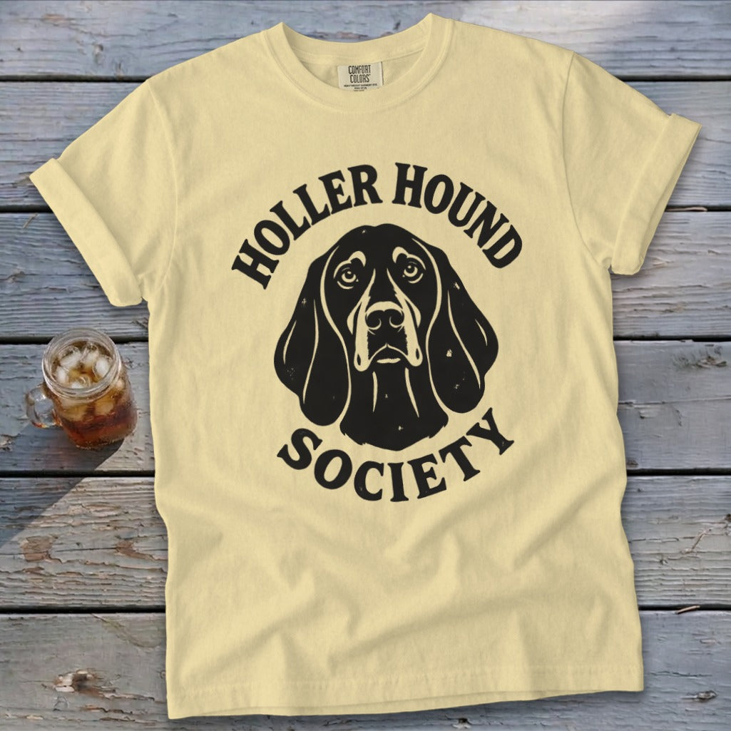 Yellow t-shirt with black "Holler Hound Society" text and dog graphic.