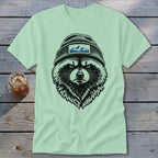 T-shirt with a black and white illustration of a raccoon wearing a beanie with mountains.