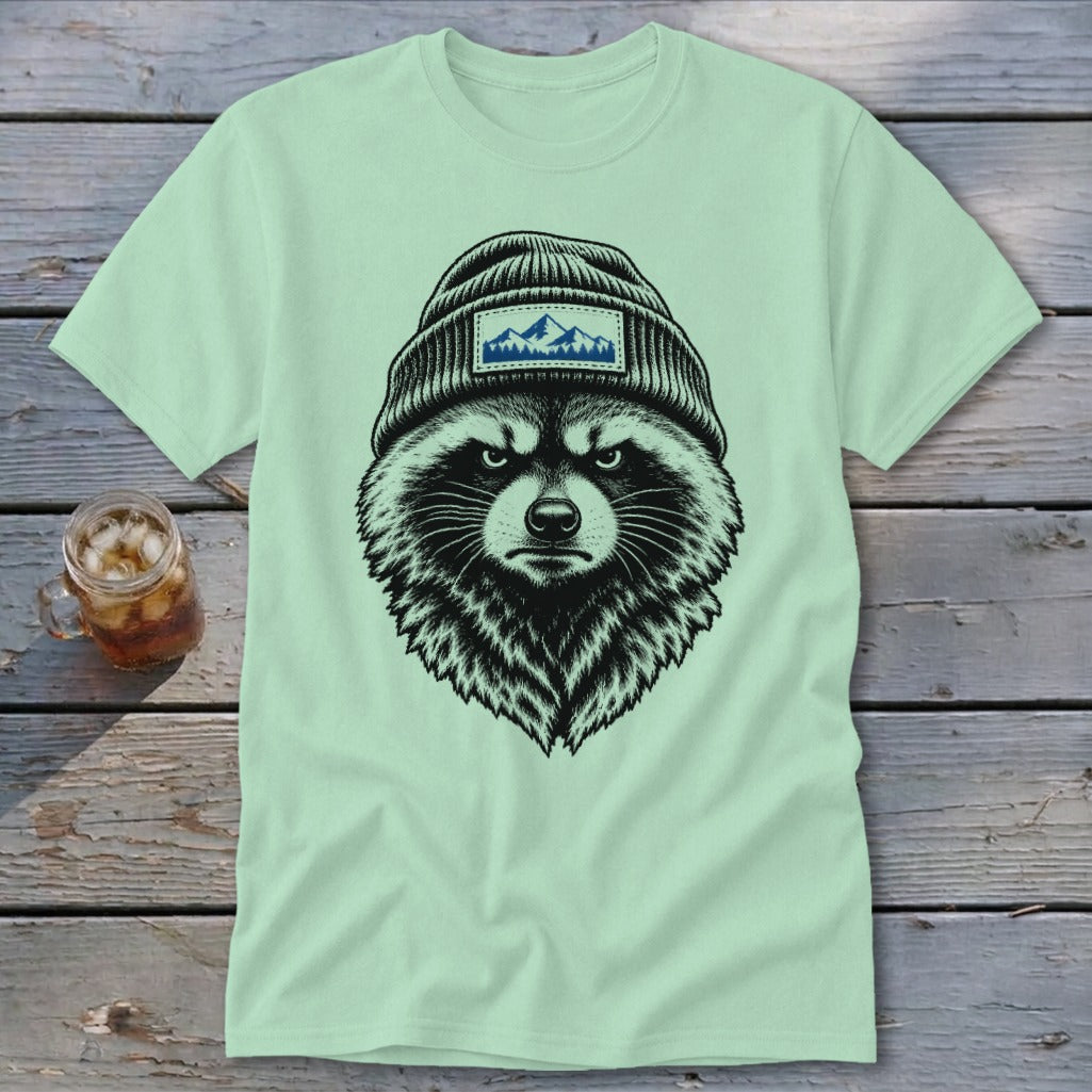 T-shirt with a black and white illustration of a raccoon wearing a beanie with mountains.