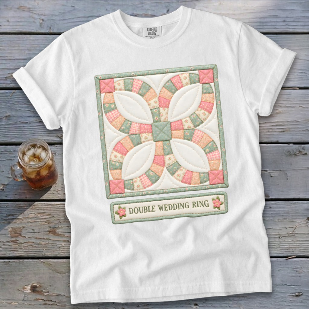 White t-shirt with a quilted double wedding ring design and text.