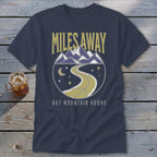 Navy t-shirt with "Miles Away But Mountain Bound" text and mountain graphic.