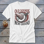 White t-shirt with a graphic of a hand playing a banjo, reading Old Sounds New Ground.