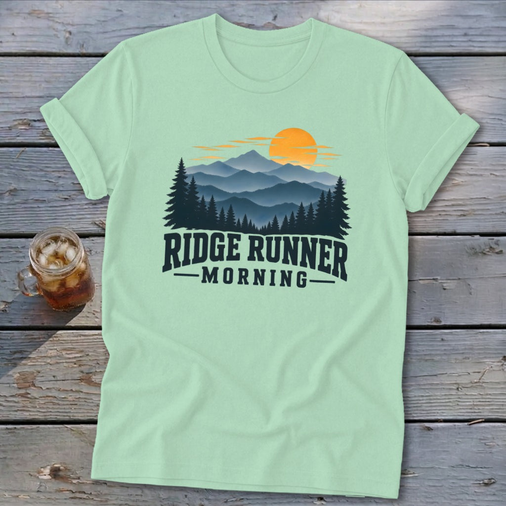 Light green t-shirt with "Ridge Runner Morning" text and mountain forest sunrise graphic.