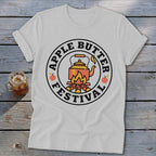 White t-shirt with "Apple Butter Festival" circular logo featuring a kettle over a campfire.