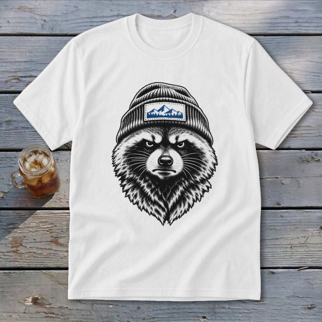 White t-shirt featuring a black and white drawing of a raccoon wearing a beanie with a mountain patch.