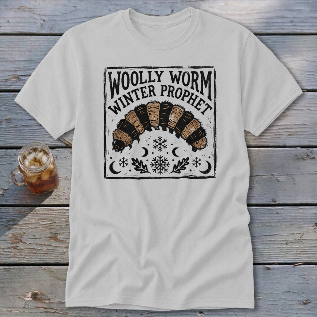 Light gray t-shirt featuring a black graphic of a woolly worm with text reading Woolly Worm Winter Prophet.