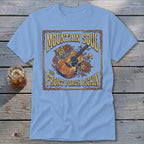 Light blue t-shirt with "Mountain Soul and Front Porch Pickin'" text and a guitar graphic.