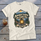 Cream t-shirt with "Always Leave the Light On Come On In" graphic featuring a lantern and landscape.