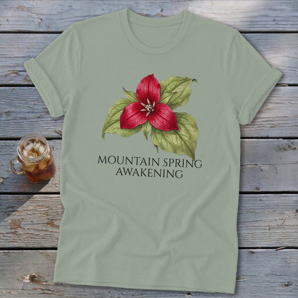 Light green t-shirt with a red trillium flower and text "MOUNTAIN SPRING AWAKENING".