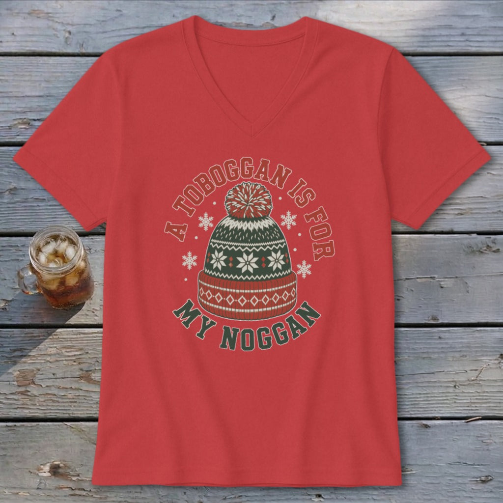 Red v-neck t-shirt featuring a holiday beanie graphic with the text A TOBOGGAN IS FOR MY NOGGAN.