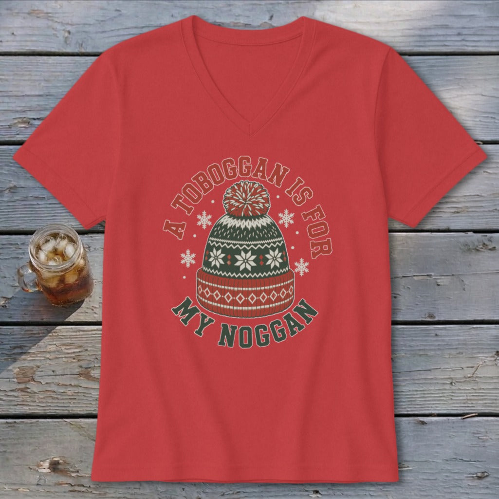 Red v-neck t-shirt featuring a holiday beanie graphic with the text A TOBOGGAN IS FOR MY NOGGAN.