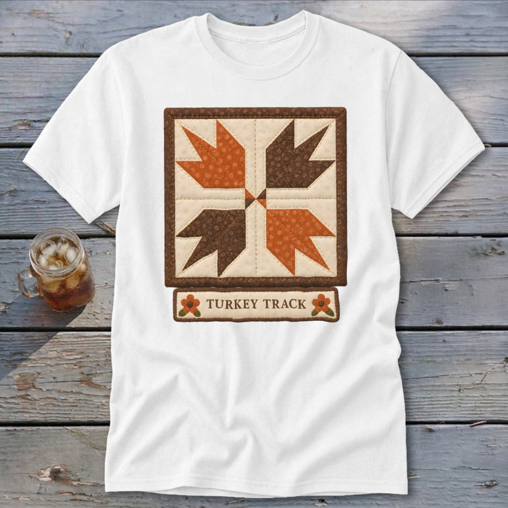 White t-shirt with a "Turkey Track" quilt block design and text.