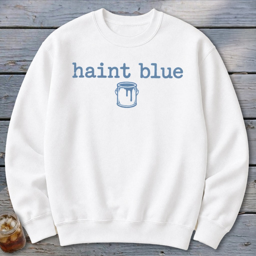 White sweatshirt with blue "haint blue" text and a paint can graphic.