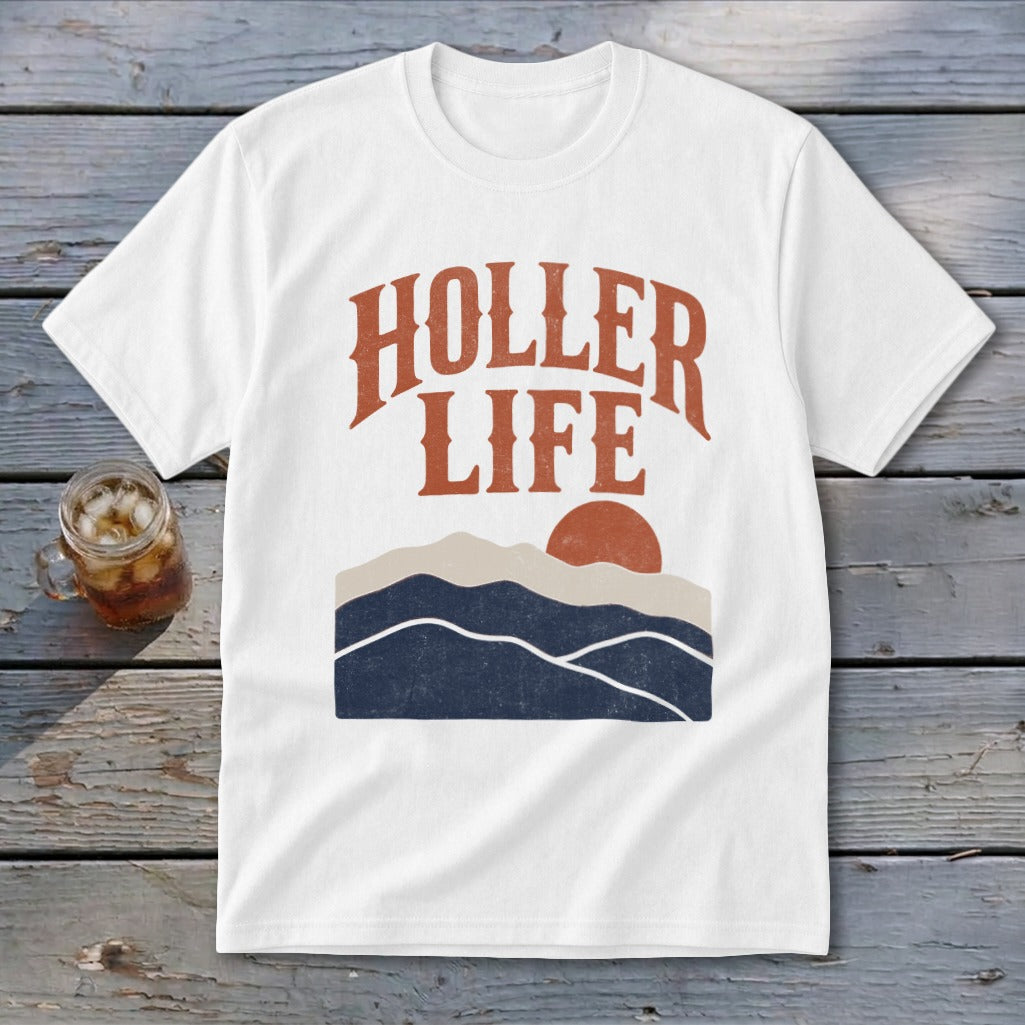 A white t-shirt featuring a retro graphic of mountains, a setting sun, and the text HOLLER LIFE.
