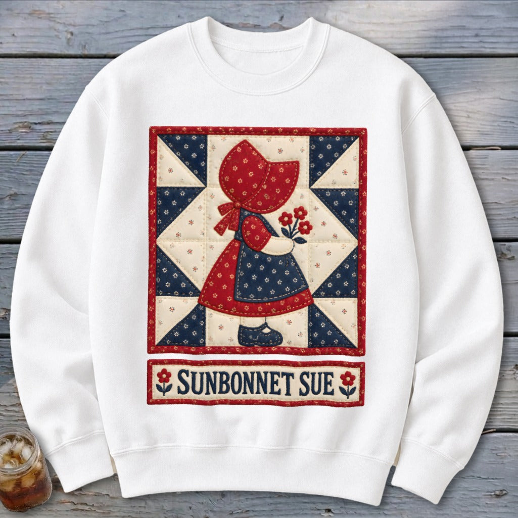 White sweatshirt featuring a quilted Sunbonnet Sue with flowers and text.