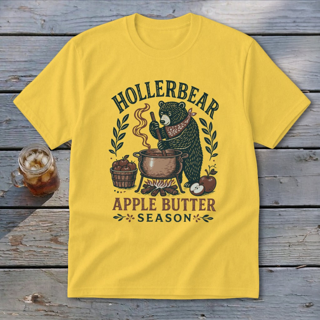 Yellow t-shirt with "Hollerbear Apple Butter Season" text and a bear cooking apples.
