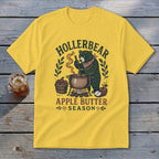 Yellow t-shirt with "Hollerbear Apple Butter Season" text and a bear cooking apples.