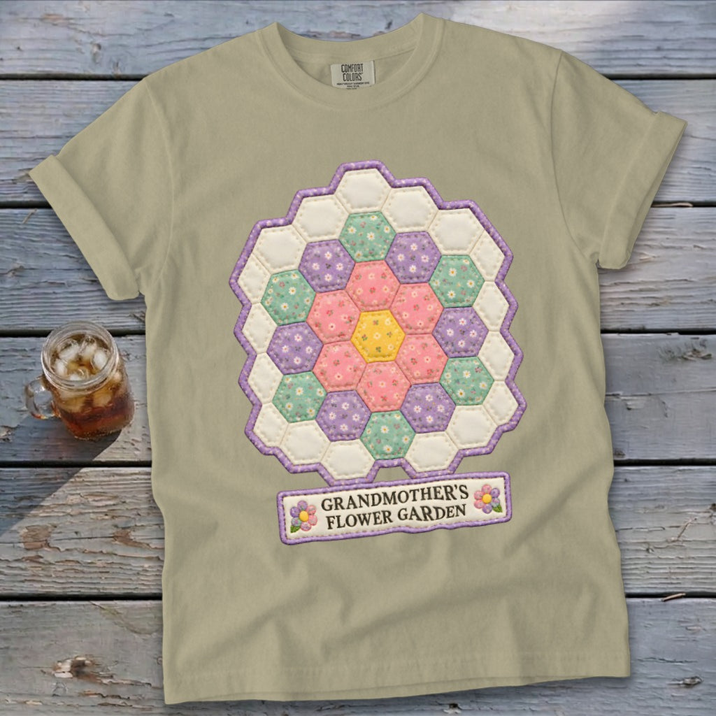 Light tan t-shirt with a hexagonal patchwork flower design and "GRANDMOTHER'S FLOWER GARDEN" text.