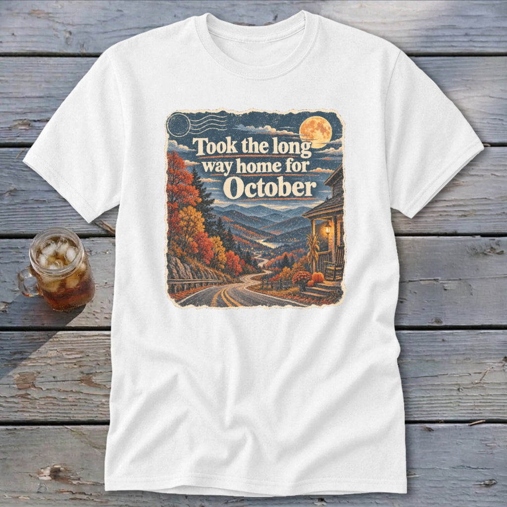 White t-shirt with graphic: "Took the long way home for October" over autumn mountain landscape.