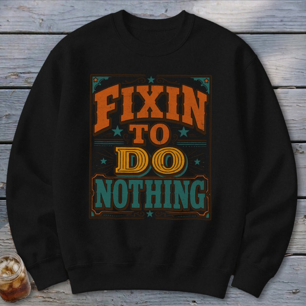 Black sweatshirt with "Fixin to Do Nothing" text graphic in orange, yellow, and teal.