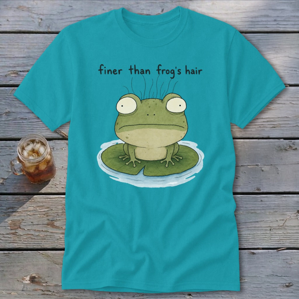 A bright blue t-shirt featuring a green frog on a lily pad with the text finer than frog's hair.