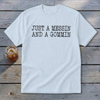 Light blue t-shirt with black text reading "JUST A MESSIN AND A GOMMIN".