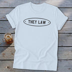 Light blue t-shirt with black text "THEY LAW" inside an oval on the chest.