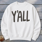 White crewneck sweatshirt with "Y'ALL" printed in dark gray text.