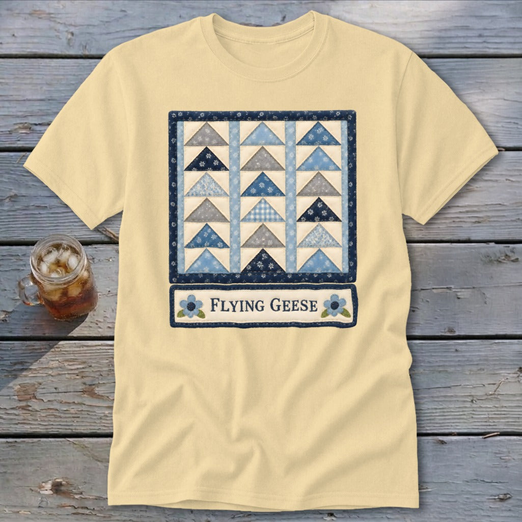 Yellow t-shirt with a quilt design featuring blue and gray triangles and "Flying Geese" text.