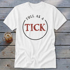 White t-shirt with red text "FULL AS A TICK" inside a black circle.