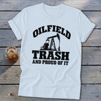 White t-shirt with black text and oil pump graphic: "Oilfield Trash And Proud Of It."