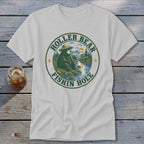 T-shirt graphic: bear in hat fishing by river, text "Holler Bear Fishin Hole".