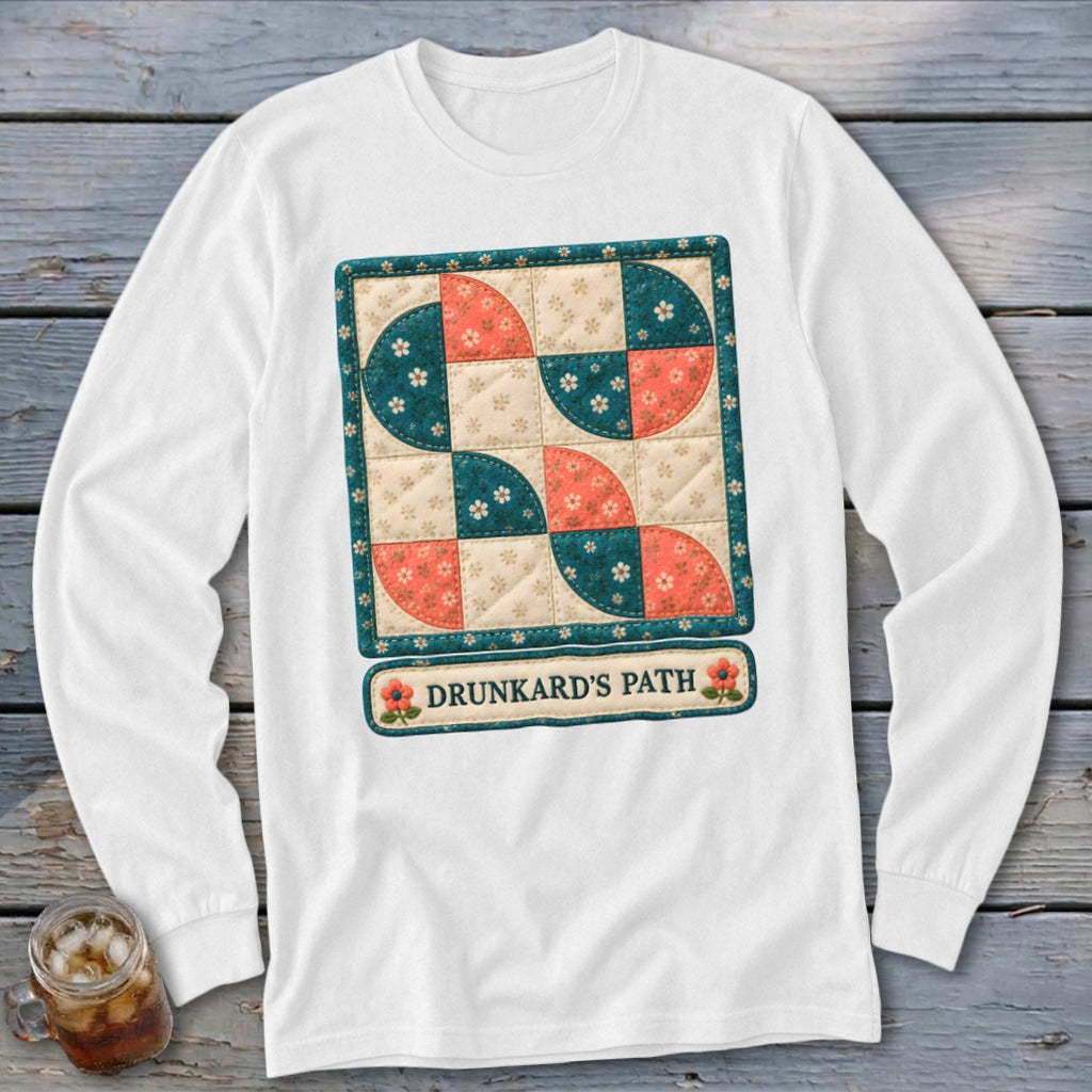 White long sleeve shirt with "Drunkard's Path" quilt design and floral accents.