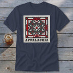 Dark blue t-shirt featuring a square geometric design and the text Appalachia laid on a wooden surface.