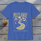Blue v-neck t-shirt with "Miles Away But Mountain Bound" text and mountain graphic.