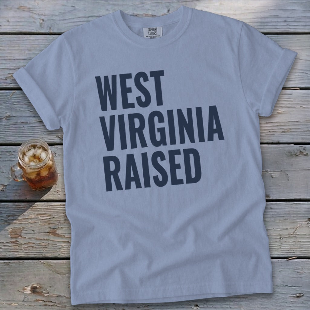 Light blue t-shirt with "WEST VIRGINIA RAISED" text and a glass of iced tea.