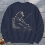 Bear fishing with a rod sitting by the water.