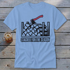 Light blue t-shirt with a graphic of stacked firewood and an axe, reading "STACKED FOR THE SEASON".