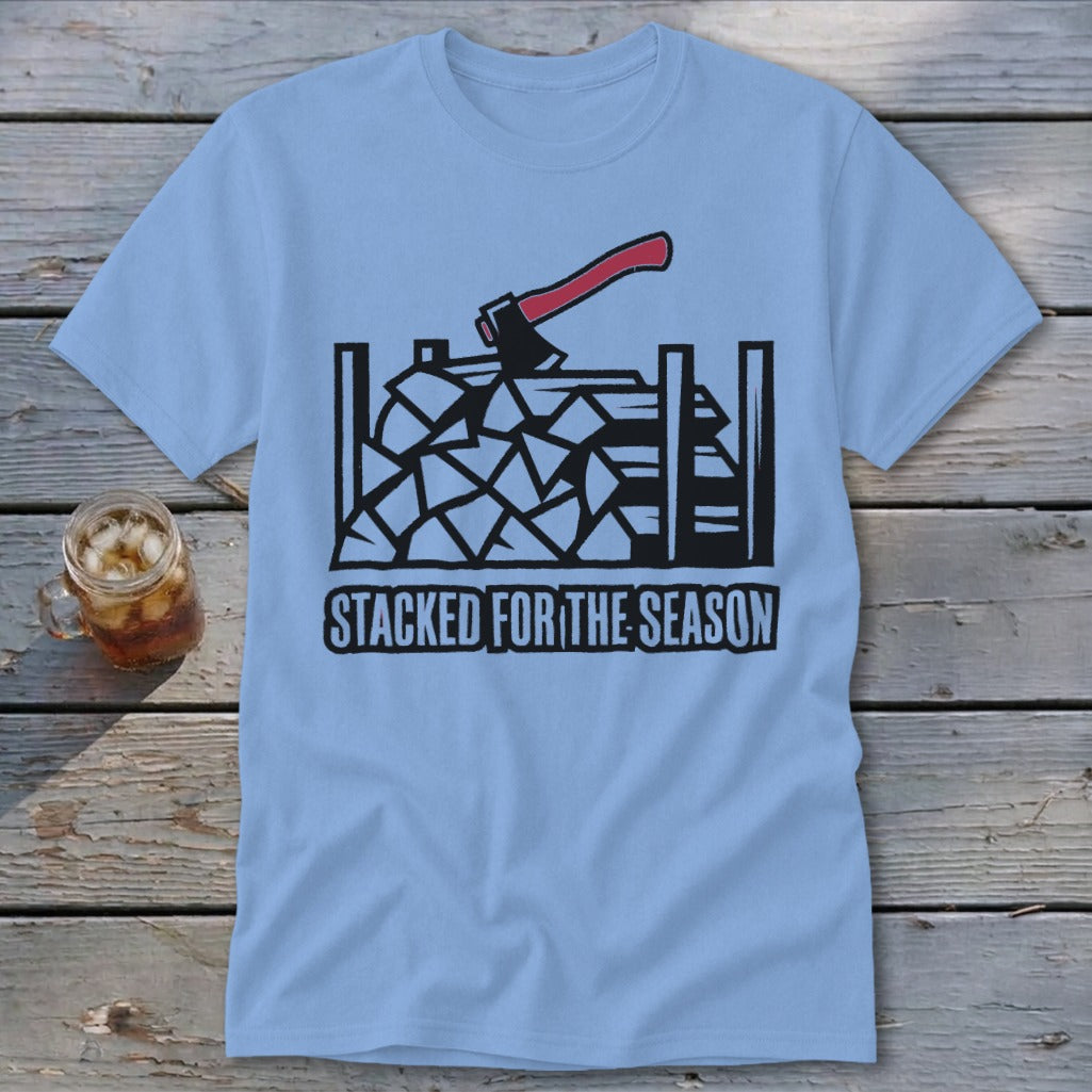 Light blue t-shirt with a graphic of stacked firewood and an axe, reading "STACKED FOR THE SEASON".