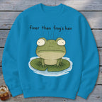 Blue crewneck sweatshirt featuring a cartoon frog on a lily pad with the text finer than frog's hair.