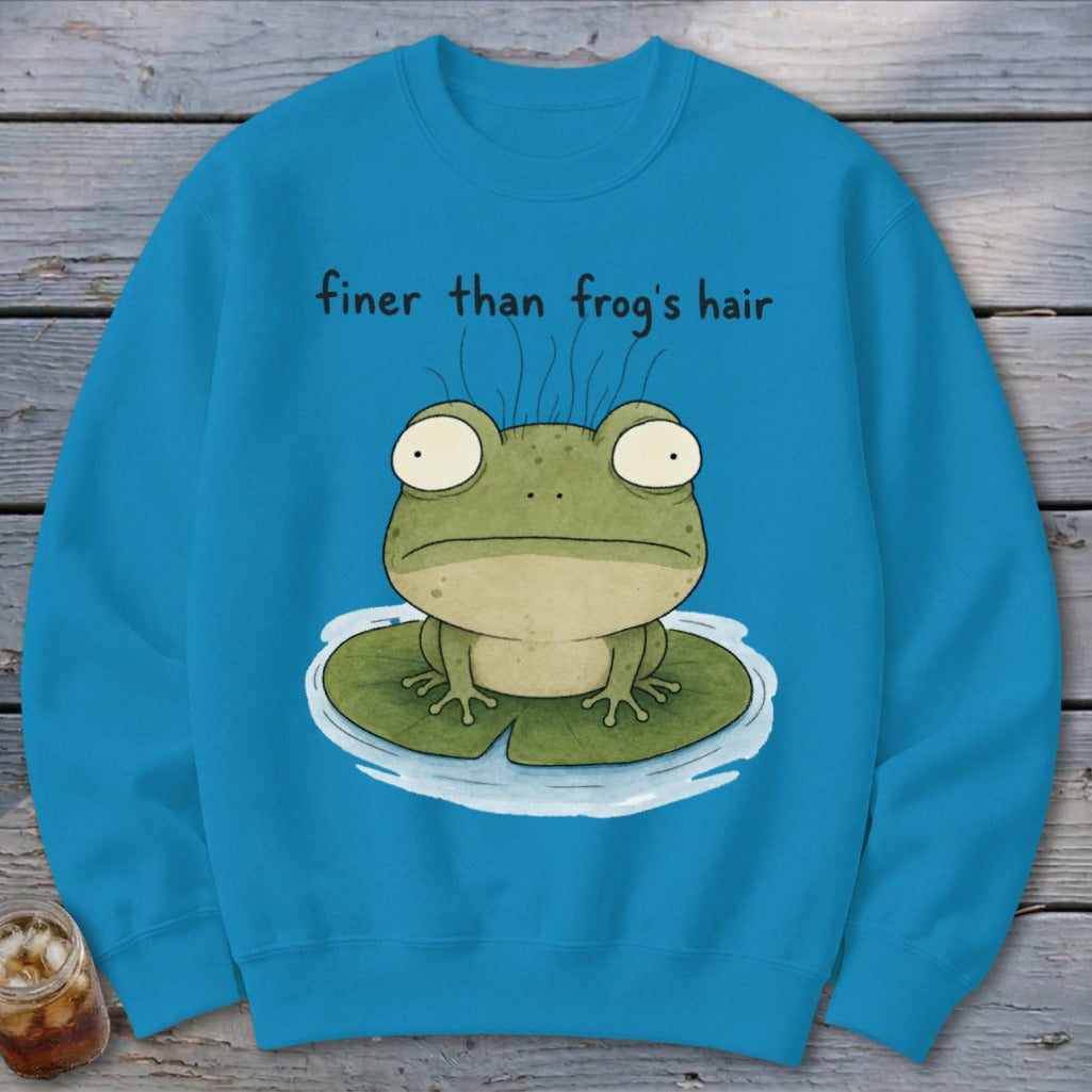 Blue crewneck sweatshirt featuring a cartoon frog on a lily pad with the text finer than frog's hair.