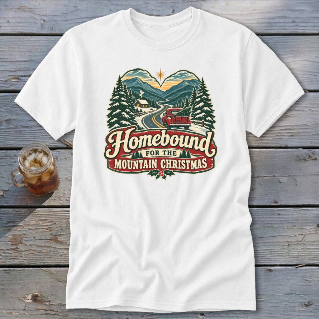White t-shirt with "Homebound For The Mountain Christmas" text and winter scene.