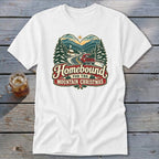 White t-shirt with "Homebound For The Mountain Christmas" text and winter scene.