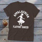Brown t-shirt featuring a white silhouette of a female dancer and the text Appalachian Flatfoot Dancer.