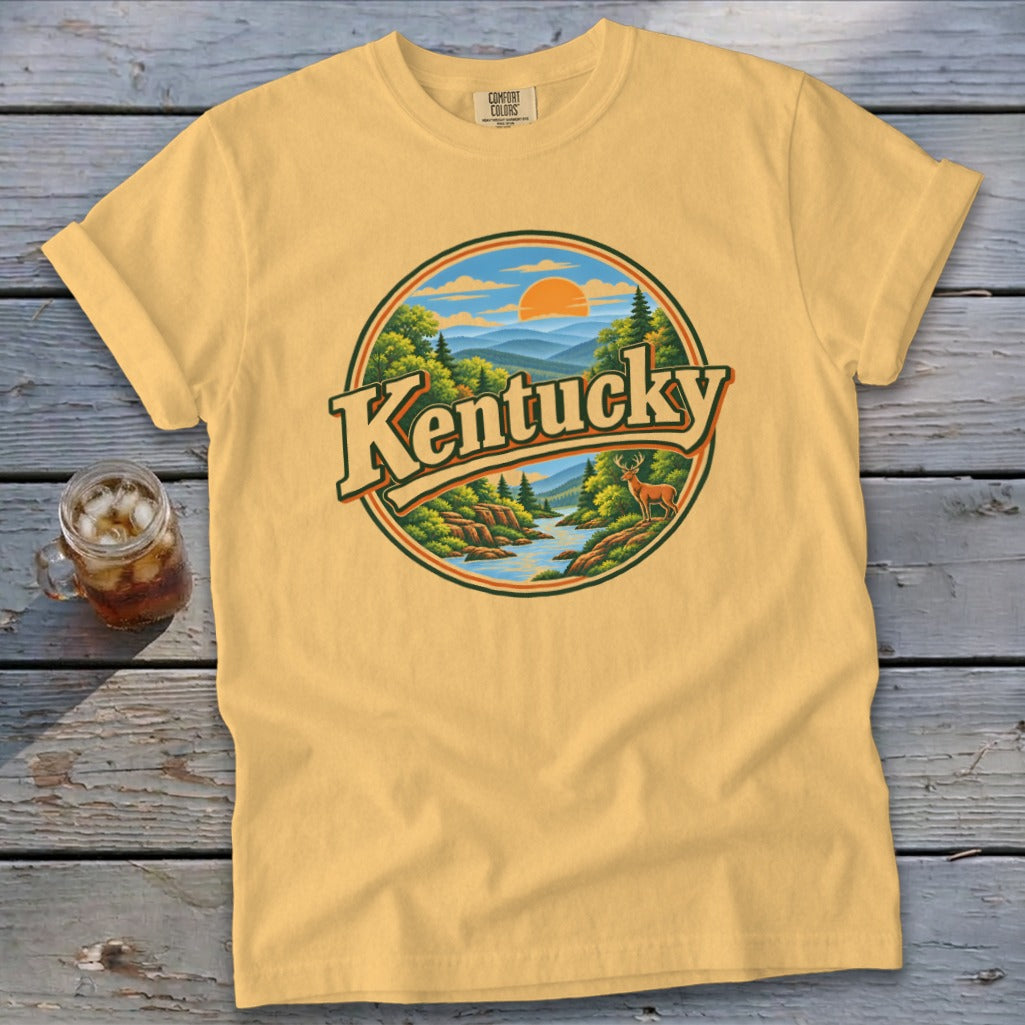 Yellow t-shirt with circular "Kentucky" landscape graphic featuring mountains, river, trees, and deer.