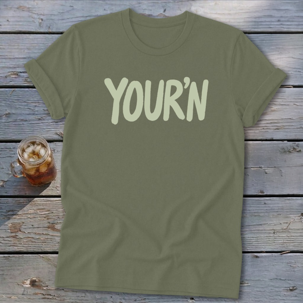 Olive green t-shirt with "YOUR'N" in light green text.