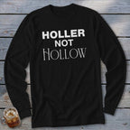 Black long-sleeve shirt with white text reading "HOLLER NOT HOLLOW".
