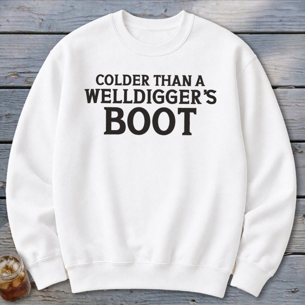 White sweatshirt with black text that reads "Colder Than A Welldigger's Boot".