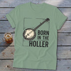 Green t-shirt with banjo graphic and text "BORN IN THE HOLLER".