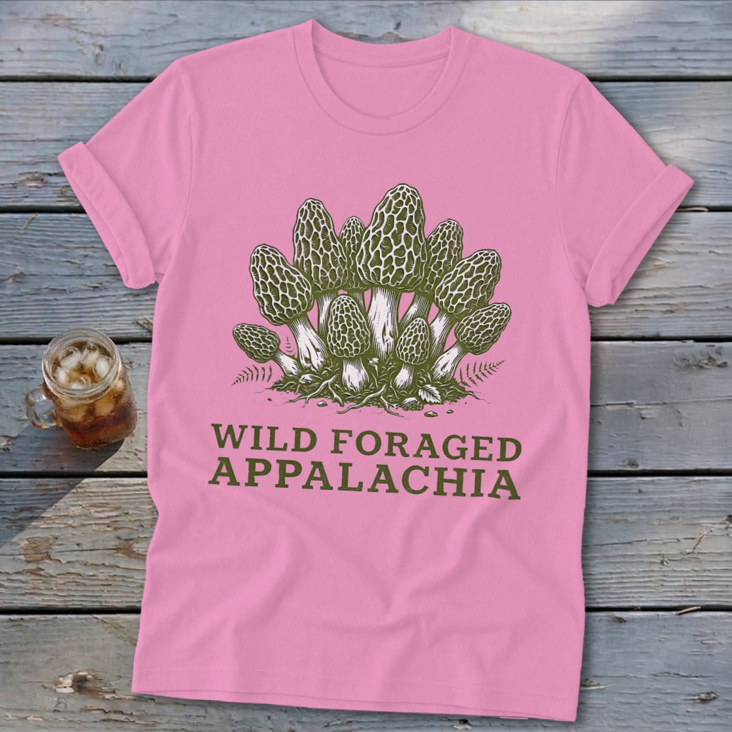 Pink t-shirt with illustration of morel mushrooms and text "WILD FORAGED APPALACHIA".